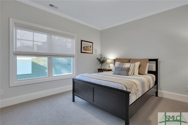 carpeted bedroom with ornamental molding