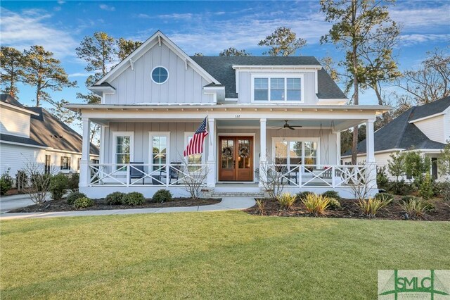 view of front facade featuring covered porch and a front yard