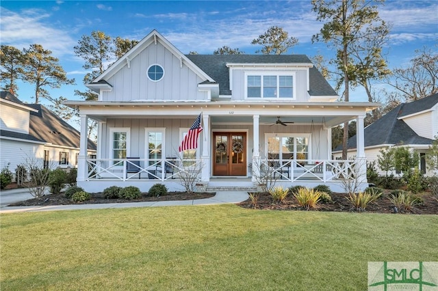 view of front of home with a porch, french doors, and a front yard