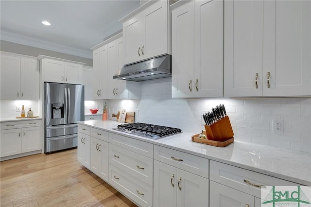 kitchen featuring light hardwood / wood-style flooring, stainless steel appliances, white cabinetry, and crown molding