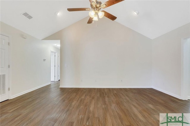 empty room featuring ceiling fan, dark wood-type flooring, and vaulted ceiling