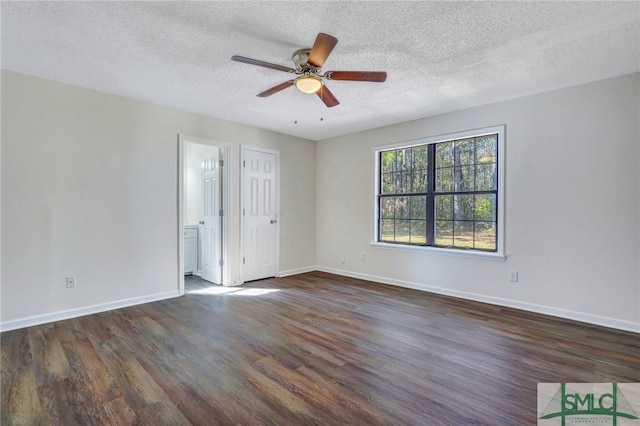 unfurnished room featuring ceiling fan, dark hardwood / wood-style floors, and a textured ceiling