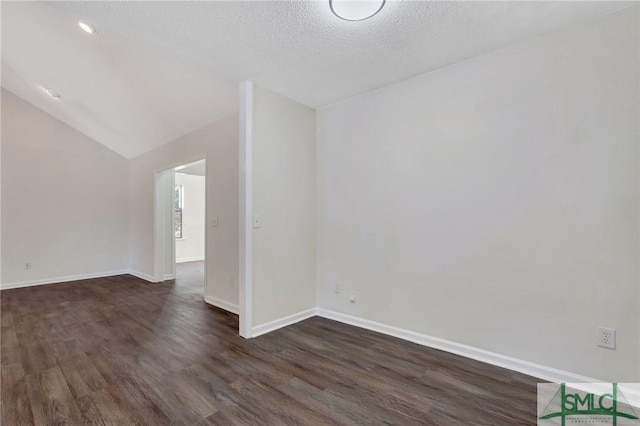 bonus room with vaulted ceiling, dark hardwood / wood-style flooring, and a textured ceiling