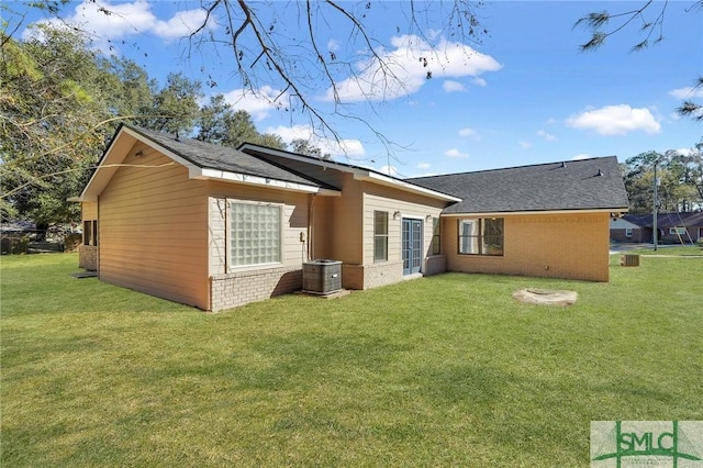 rear view of house with a lawn