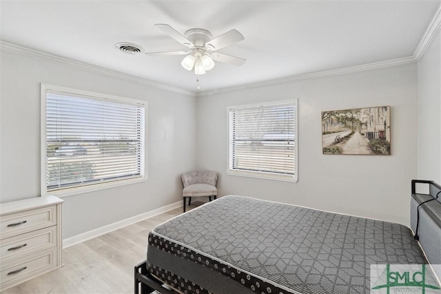 108 Dawson Ln, Ludowici, GA 31316 - bedroom featuring ceiling fan, ornamental molding, and light hardwood / wood-style flooring