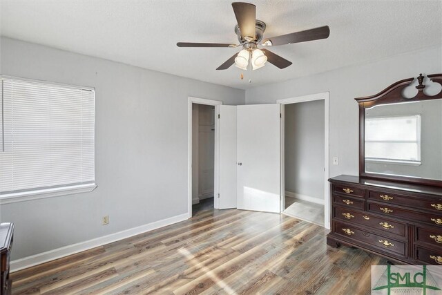 108 Dawson Ln, Ludowici, GA 31316 - unfurnished bedroom featuring ceiling fan, a closet, and hardwood / wood-style flooring