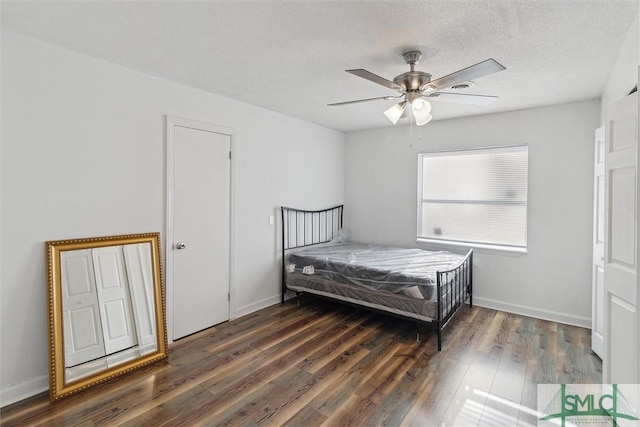 108 Dawson Ln, Ludowici, GA 31316 - bedroom featuring a textured ceiling, ceiling fan, and dark hardwood / wood-style floors