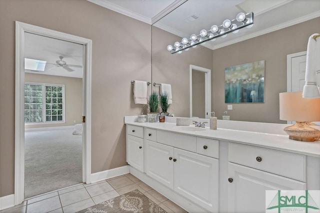 bathroom featuring tile patterned floors, ceiling fan, ornamental molding, and vanity