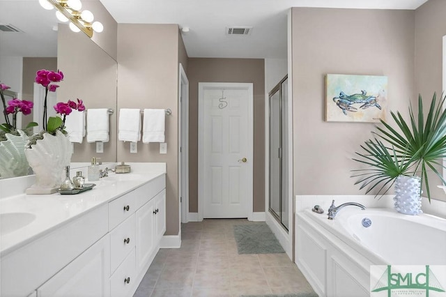 bathroom with tile patterned floors, separate shower and tub, and vanity