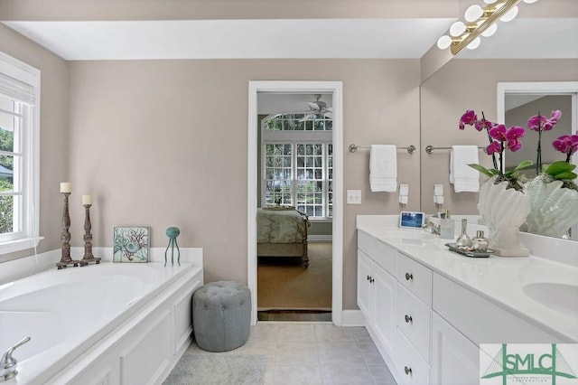 bathroom with vanity and a tub