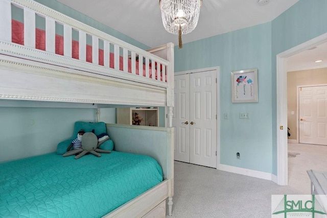 bedroom featuring a notable chandelier and a closet