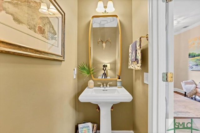 bathroom with crown molding