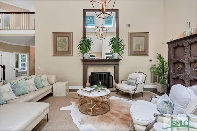 living room featuring crown molding and a notable chandelier