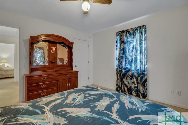 bedroom with ceiling fan and carpet floors