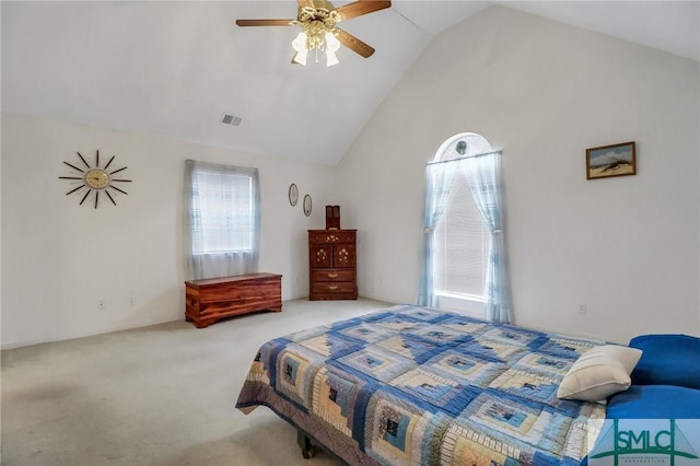 bedroom featuring multiple windows, light colored carpet, ceiling fan, and lofted ceiling