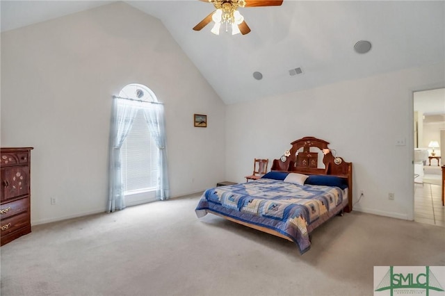 carpeted bedroom featuring ceiling fan and vaulted ceiling