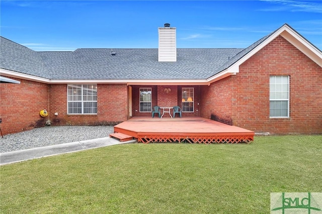 rear view of house with a lawn