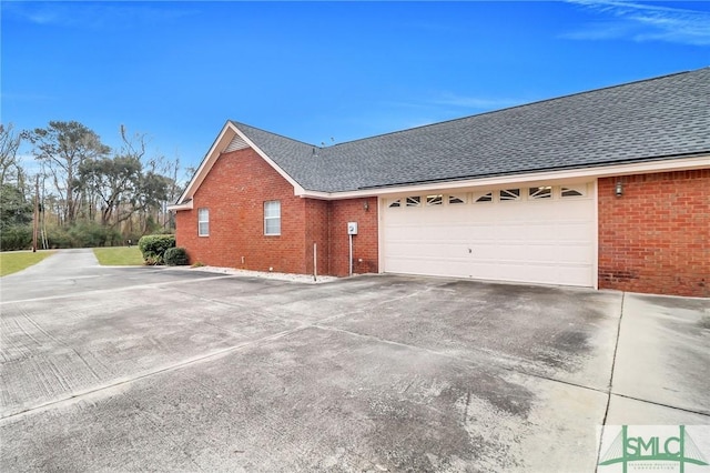 view of side of home with a garage