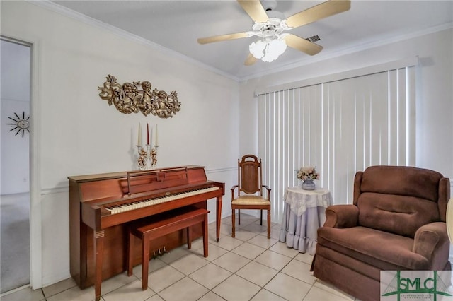 sitting room with light tile patterned flooring and ornamental molding