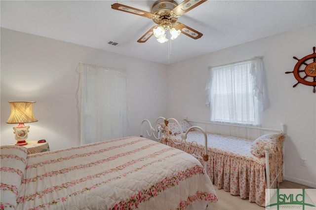 carpeted bedroom featuring ceiling fan