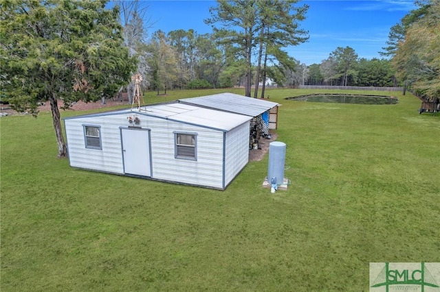 view of outdoor structure featuring a lawn