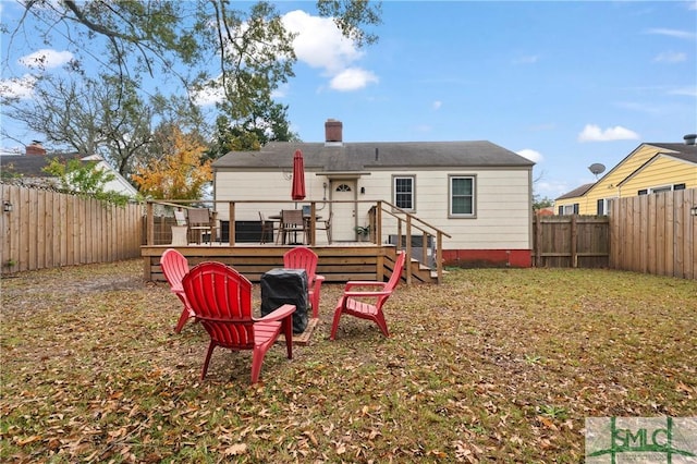 rear view of house featuring a deck