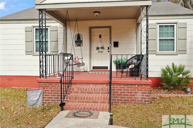 property entrance with covered porch