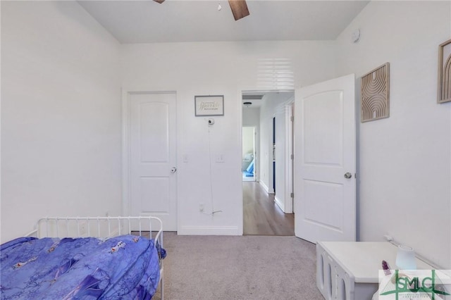 carpeted bedroom featuring ceiling fan