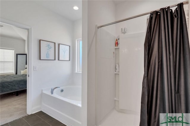 bathroom featuring a wealth of natural light, tile patterned flooring, and independent shower and bath