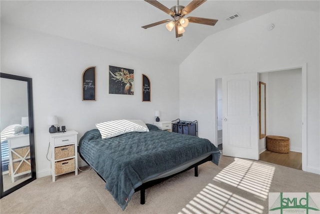 bedroom featuring light carpet, vaulted ceiling, and ceiling fan