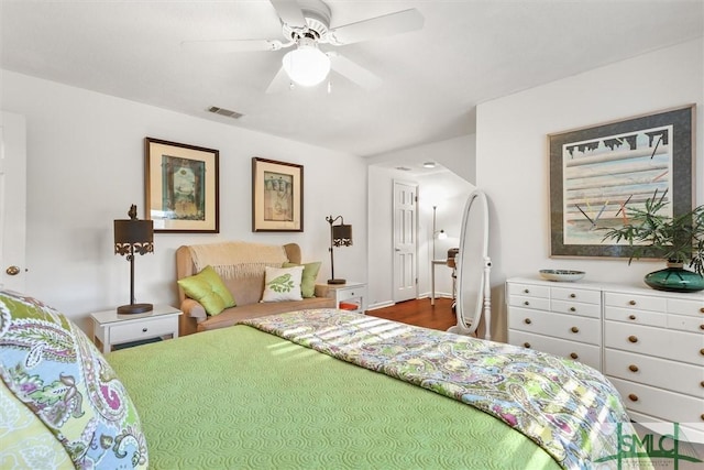 bedroom with ceiling fan and hardwood / wood-style flooring