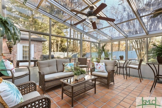 sunroom / solarium featuring ceiling fan