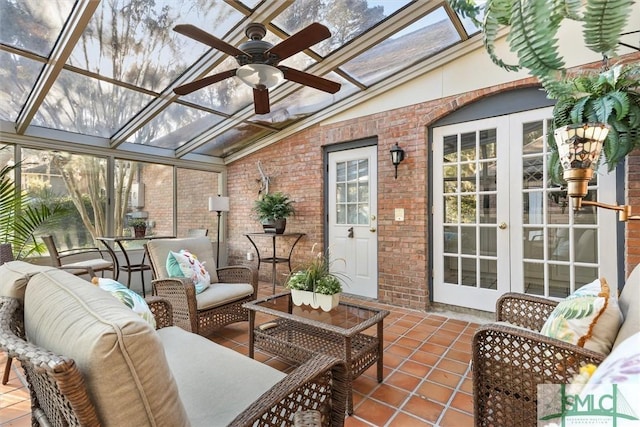 sunroom with a wealth of natural light, french doors, ceiling fan, and lofted ceiling