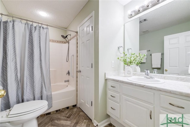 full bathroom featuring shower / bath combination with curtain, parquet floors, vanity, a textured ceiling, and toilet