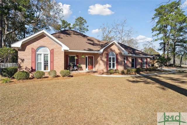 ranch-style home with a front yard