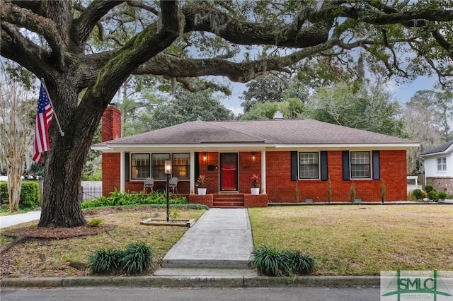 ranch-style house with a front lawn