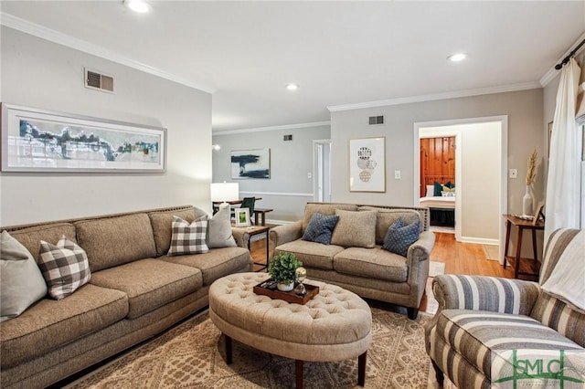 living room featuring light hardwood / wood-style floors and ornamental molding