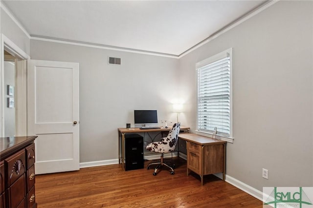 office area with a healthy amount of sunlight, crown molding, and dark wood-type flooring