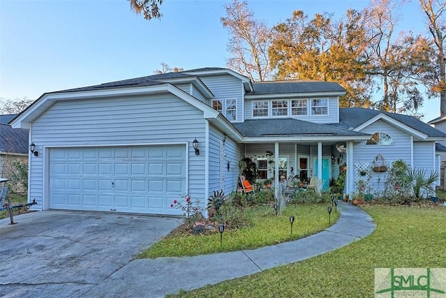 front facade featuring a garage and a front yard