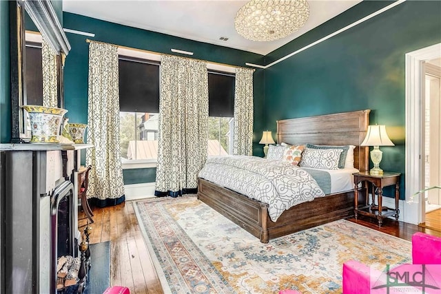 bedroom with wood-type flooring