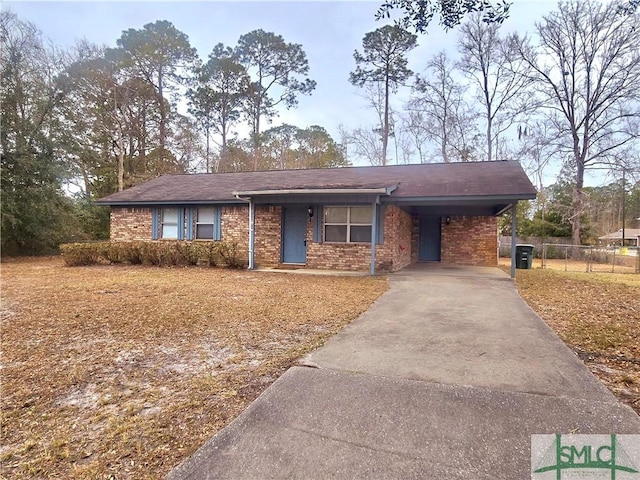 ranch-style home featuring a carport