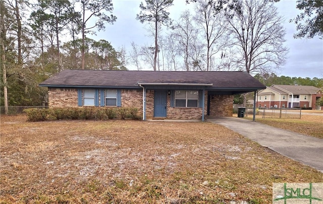 single story home featuring a carport