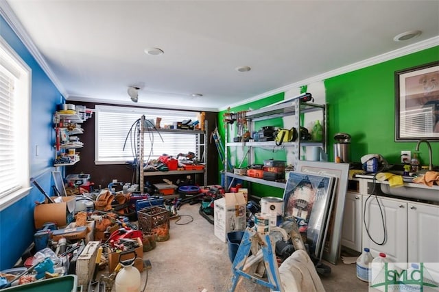 misc room featuring ornamental molding, a wealth of natural light, and concrete floors