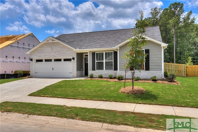 view of front facade featuring a garage and a front lawn