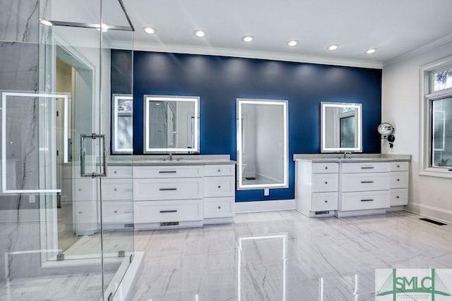 bathroom with crown molding, vanity, and walk in shower