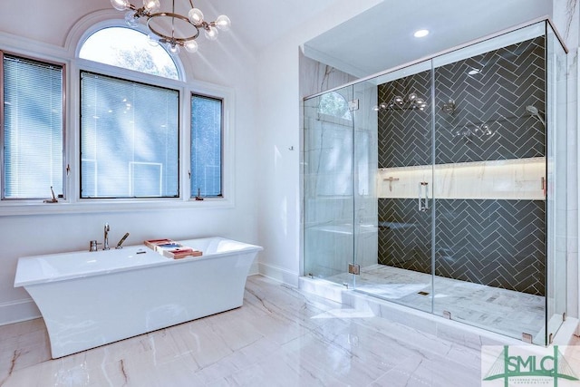 bathroom featuring plus walk in shower and a chandelier