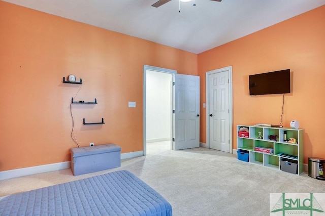 bedroom featuring ceiling fan and light colored carpet