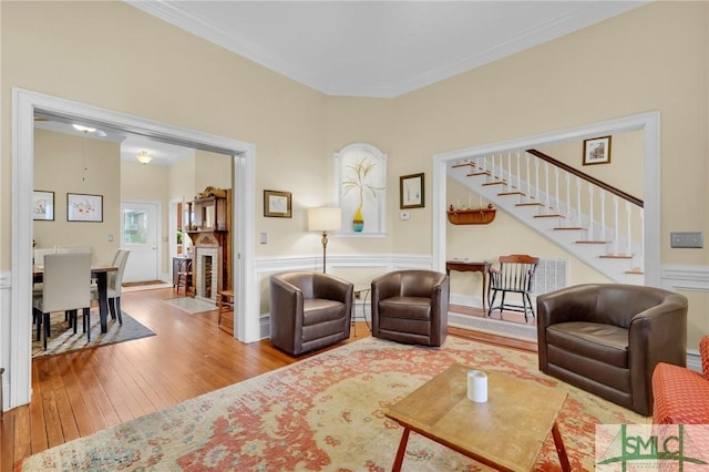 living room featuring crown molding and hardwood / wood-style floors