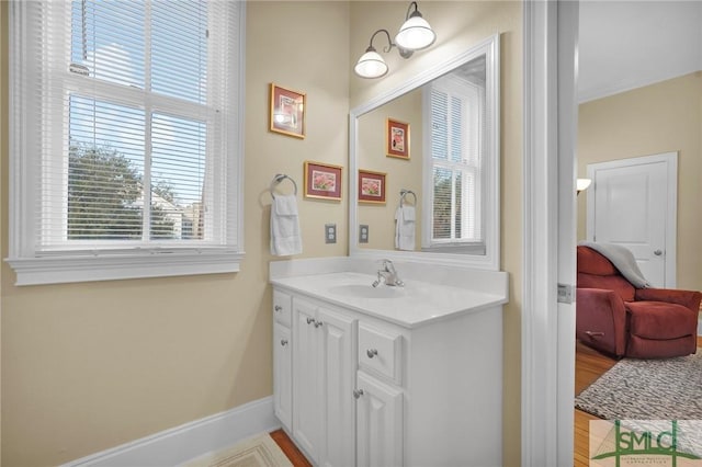 bathroom featuring vanity and hardwood / wood-style flooring