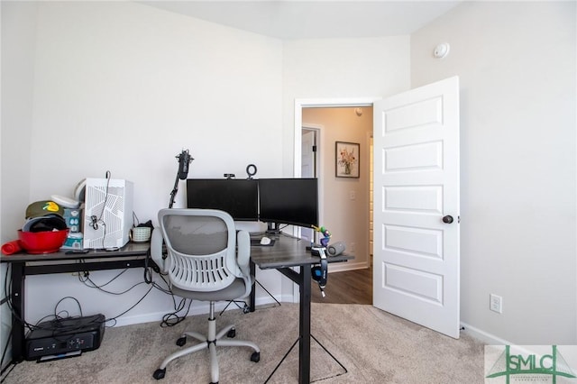 office area with light carpet and baseboards